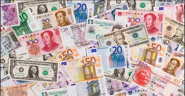 A variety of global currencies including the US dollar, Euro, British Pound, and Chinese Yuan, representing the diverse currency trading opportunities in forex markets.